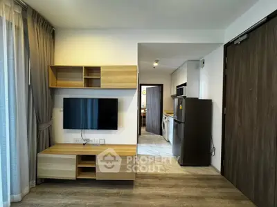 Modern living room with sleek wooden furniture and open kitchen layout in a stylish apartment.