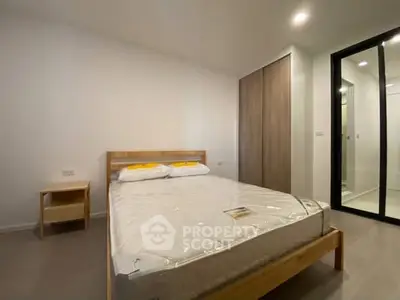 Modern bedroom with minimalist design and ample natural light