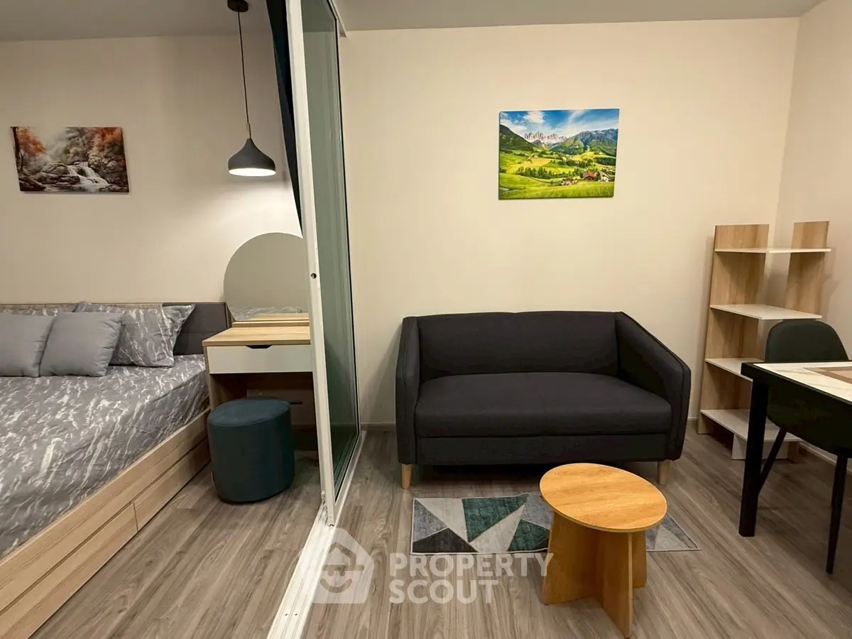 Modern studio apartment with cozy living area and stylish decor