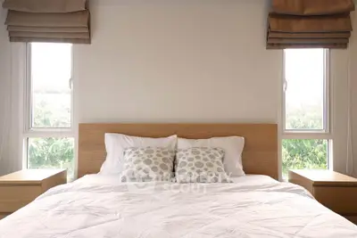 Cozy bedroom with natural light and modern decor