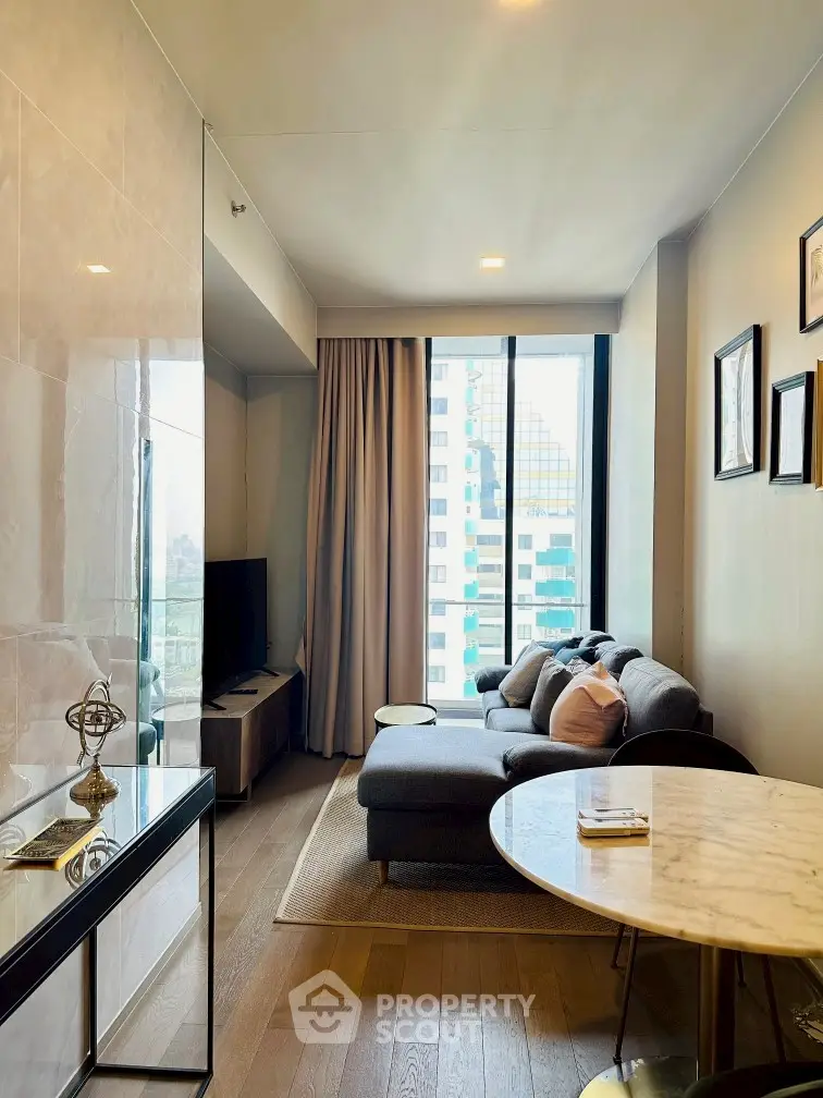 Modern living room with cozy sofa and large window view