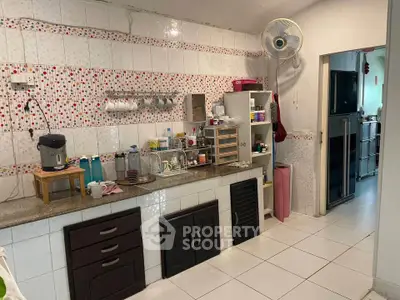 Charming kitchen with open layout and modern appliances, perfect for culinary enthusiasts.