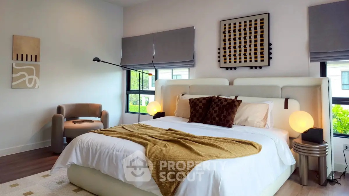 Luxurious modern bedroom with stylish decor and large windows