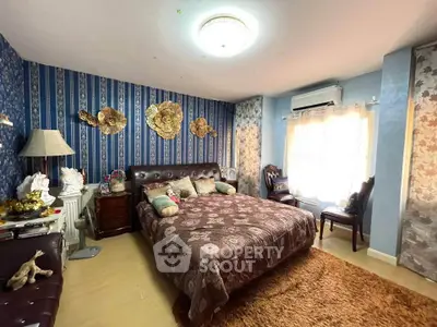 Luxurious bedroom with elegant decor and plush bedding in a stylish home