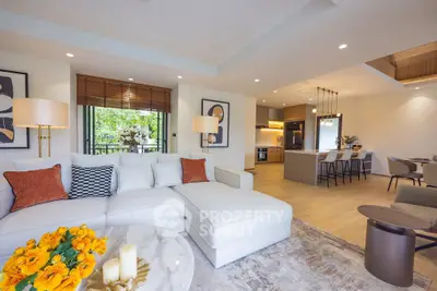 Luxurious open-plan living room with modern kitchen and elegant decor