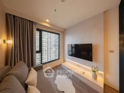 Modern living room with large window and wall-mounted TV in urban apartment