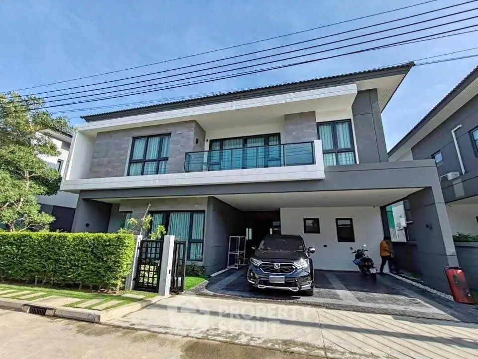 Modern two-story house with sleek design and spacious driveway