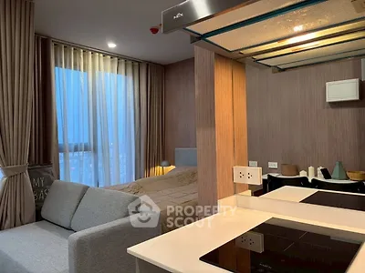 Modern studio apartment with cozy living area and stylish kitchen