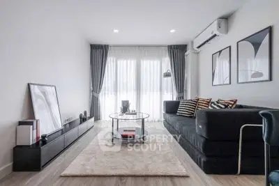Modern living room with sleek furniture and large windows, perfect for stylish urban living.