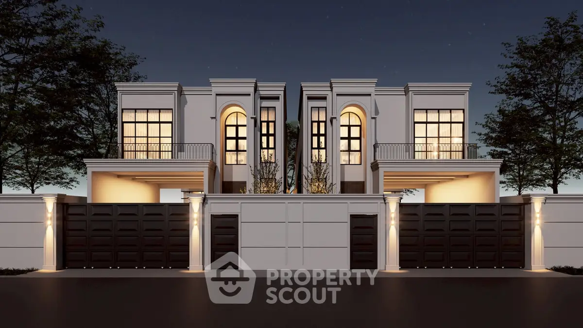 Luxurious modern villa exterior with elegant lighting and grand entrance at night.