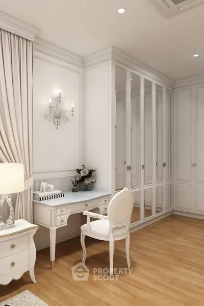 Elegant bedroom with classic white furniture and mirrored wardrobe