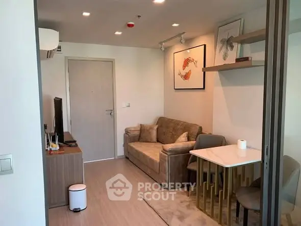 Modern living room with cozy sofa and dining area in stylish apartment