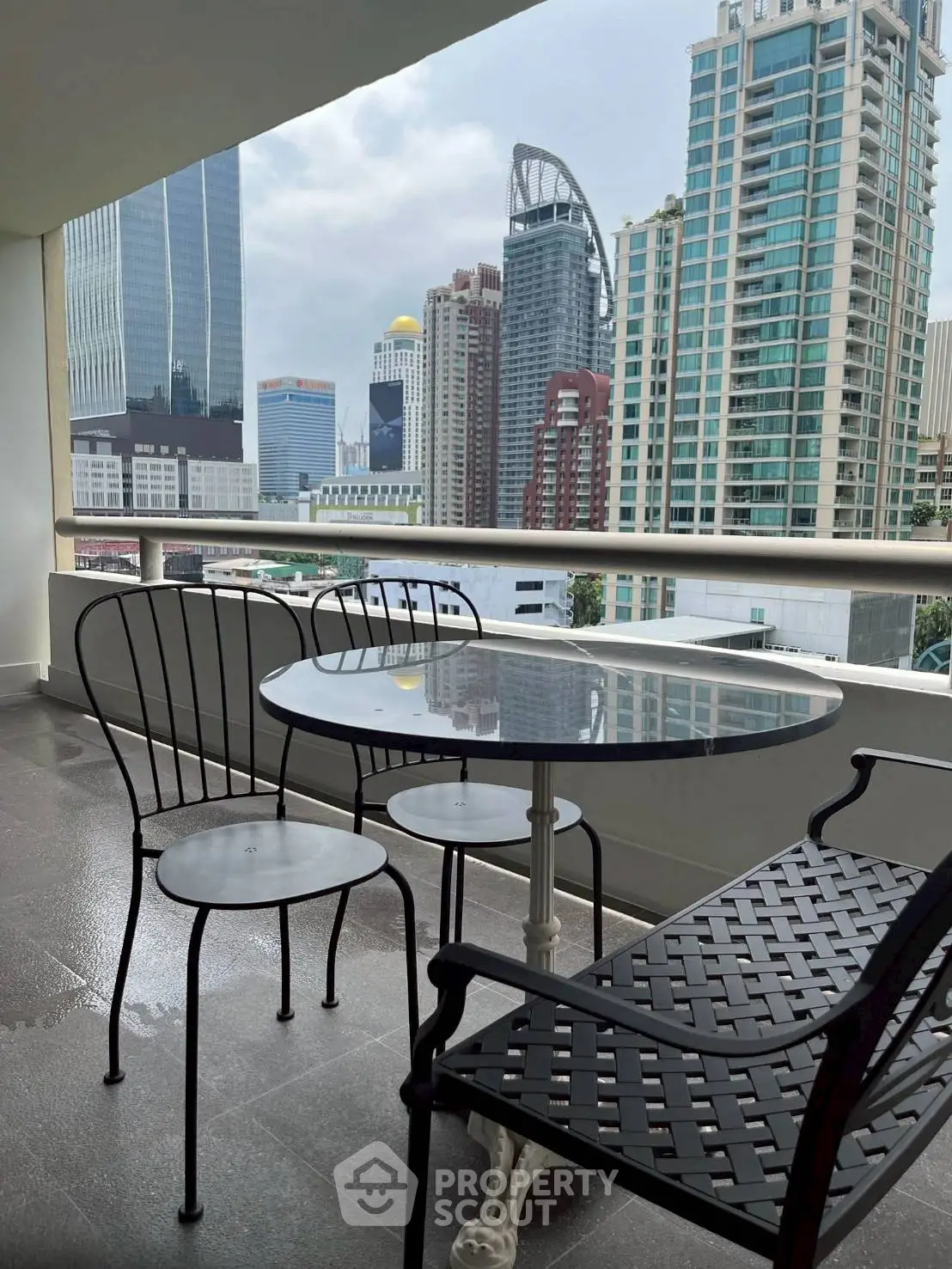 Modern balcony with city skyline view, perfect for urban living.