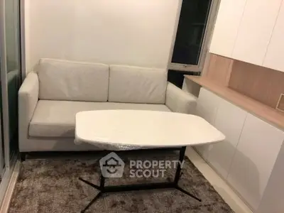 Cozy living room with modern sofa and sleek storage cabinets