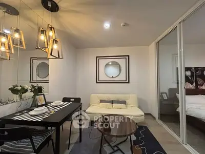 Modern living room with stylish lighting and cozy dining area