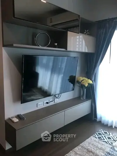 Modern living room with sleek TV unit and elegant decor