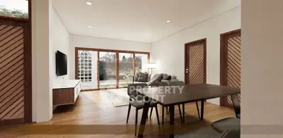 Spacious modern living room with elegant wooden flooring and large windows.
