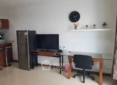 Modern living room with sleek furniture and wall-mounted TV, ideal for urban living.