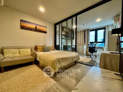 Modern studio apartment with cozy living area and city view