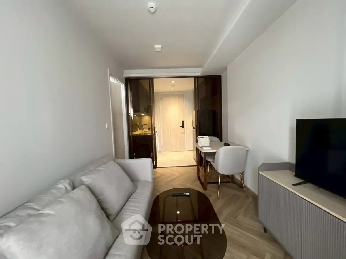 Modern living room with sleek furniture and stylish decor in a contemporary apartment.