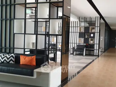 Modern living room with stylish partition and cozy seating area