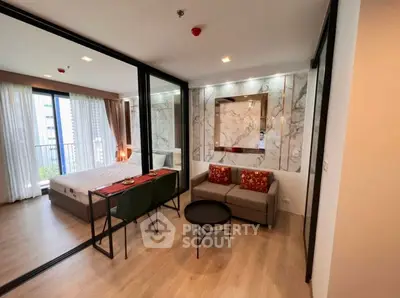 Modern studio apartment with stylish decor and large windows