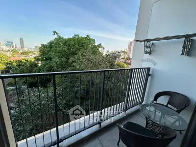 Charming balcony with city view, perfect for relaxing and enjoying the urban landscape.