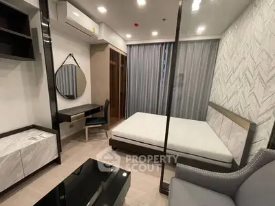 Modern bedroom with stylish decor and ample natural light