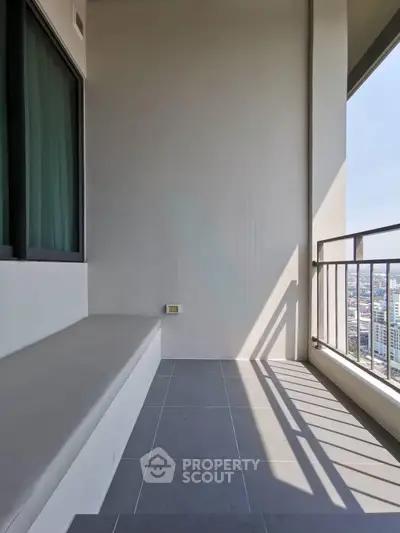 Spacious balcony with city view, perfect for relaxation and enjoying the skyline.