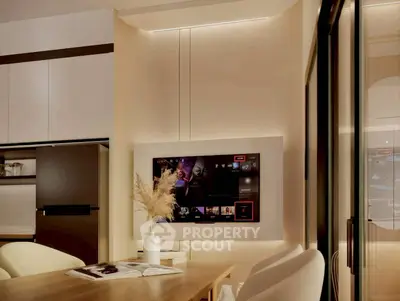 Modern living room with sleek TV setup and elegant decor, perfect for stylish urban living.