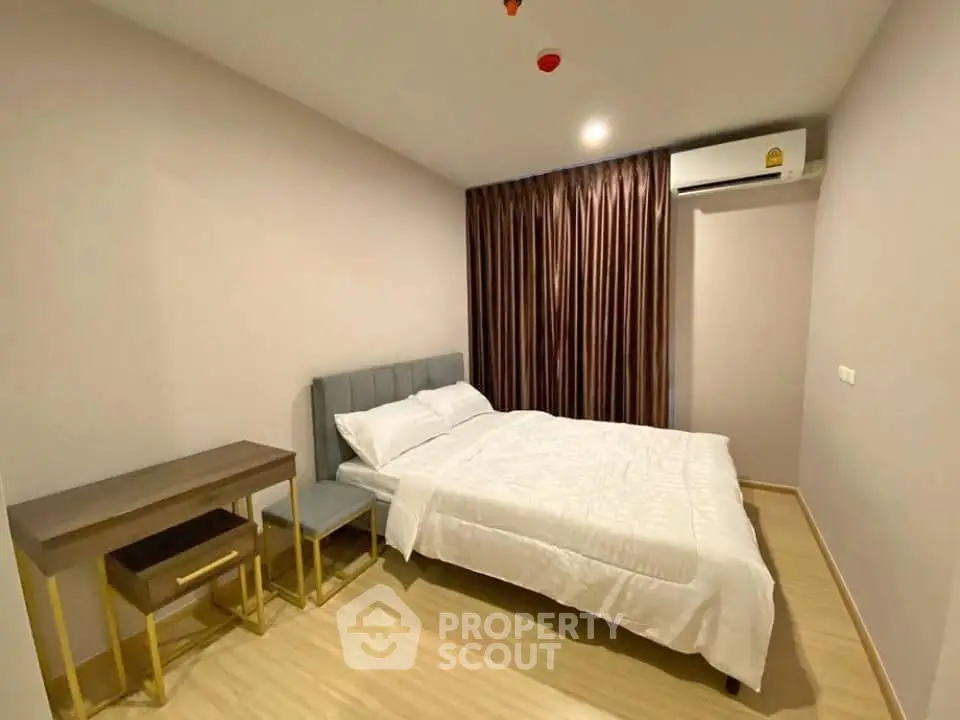 Modern bedroom with stylish furniture and cozy ambiance in a contemporary apartment.