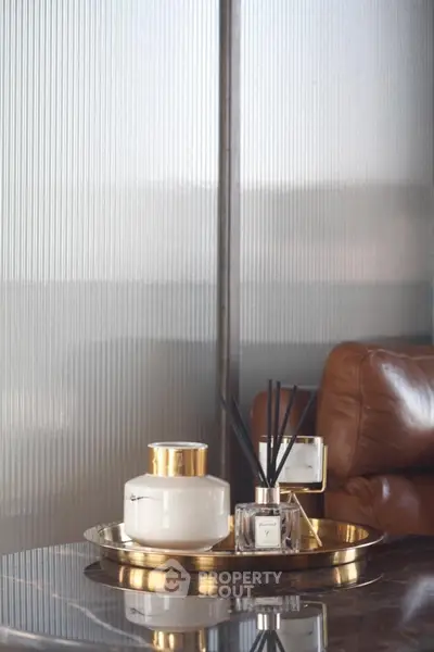 Luxurious interior decor with leather chair and elegant gold accents
