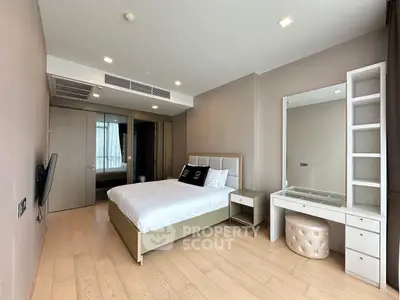Spacious modern bedroom with elegant decor and natural light