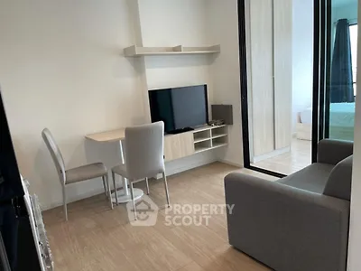 Modern compact living room with TV and cozy seating area