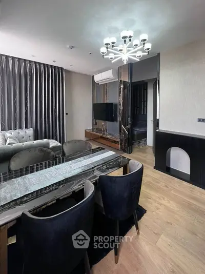 Elegant living room with modern chandelier and stylish furniture