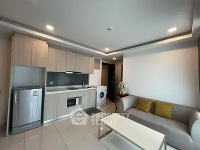 Modern living room with integrated kitchen and appliances