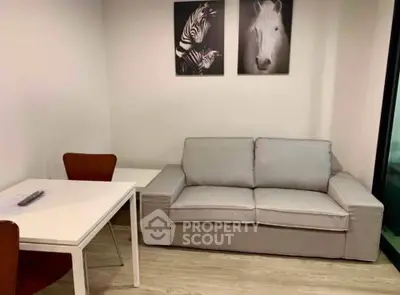 Modern living room with stylish sofa and minimalist decor, perfect for urban living.