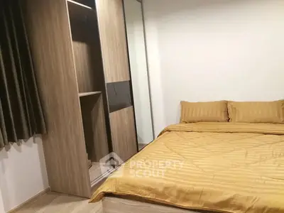 Cozy bedroom with modern wooden wardrobe and elegant bedding