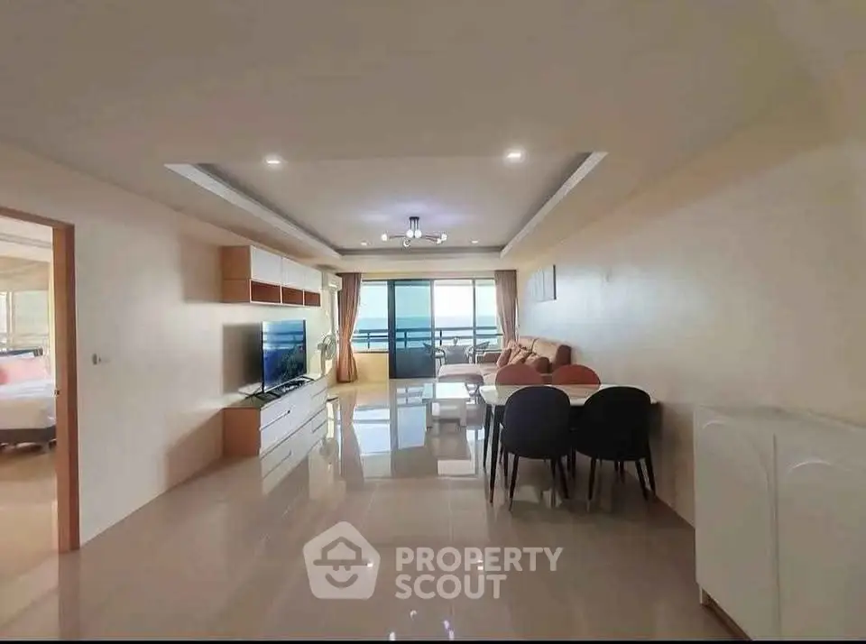 Spacious modern living room with balcony and elegant dining area