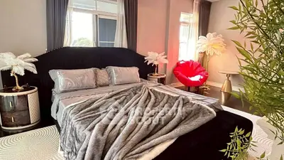 Luxurious bedroom with elegant decor and plush bedding