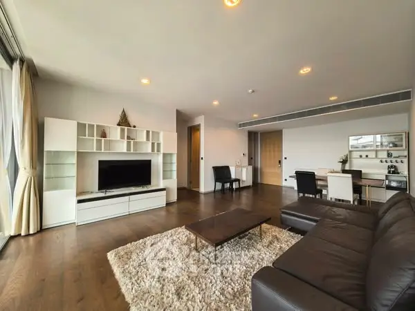 Spacious modern living room with sleek furniture and large windows