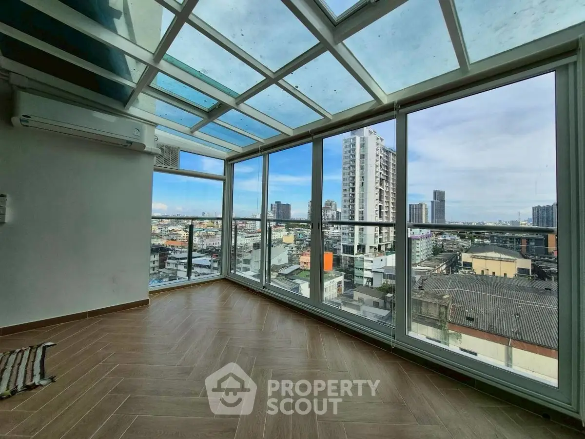 Stunning corner unit with panoramic city views and floor-to-ceiling windows.