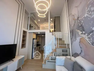 Modern loft apartment with stylish interior, high ceilings, and elegant lighting fixtures.