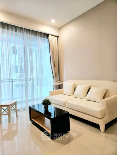 Modern living room with elegant sofa and floor-to-ceiling windows