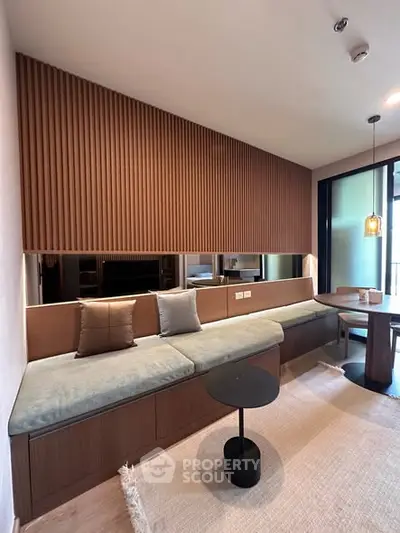 Modern living room with stylish wood paneling and cozy seating area