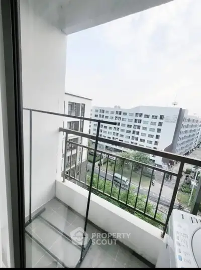Charming balcony with city view, perfect for relaxation and enjoying urban scenery.