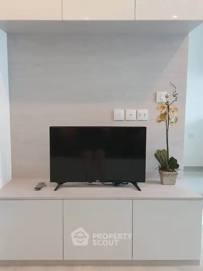 Modern living room with sleek TV unit and elegant decor