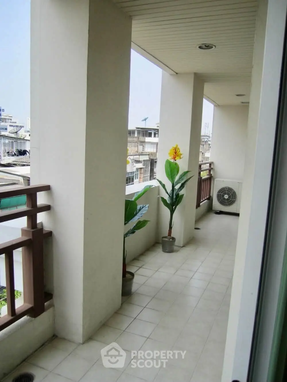 Spacious balcony with city view, perfect for relaxation and enjoying the urban landscape.