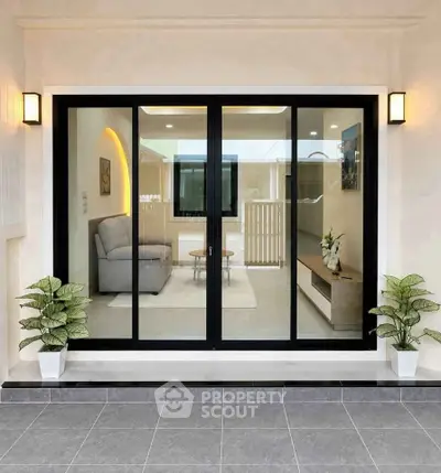 Modern living room with sliding glass doors and stylish interior design