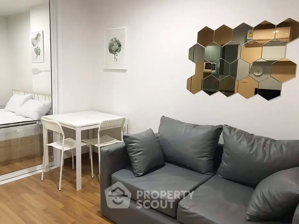 Modern living room with stylish decor and cozy seating in a contemporary apartment.